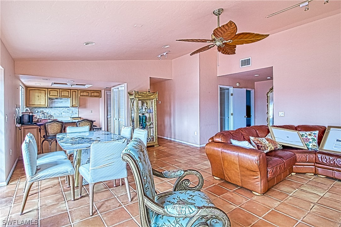 954 Sand Castle Road Sanibel, FL 33957 - Photo 10 of 29 a living room with furniture and a chandelier