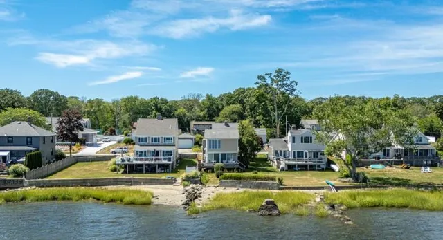 a view of a swimming pool and a yard
