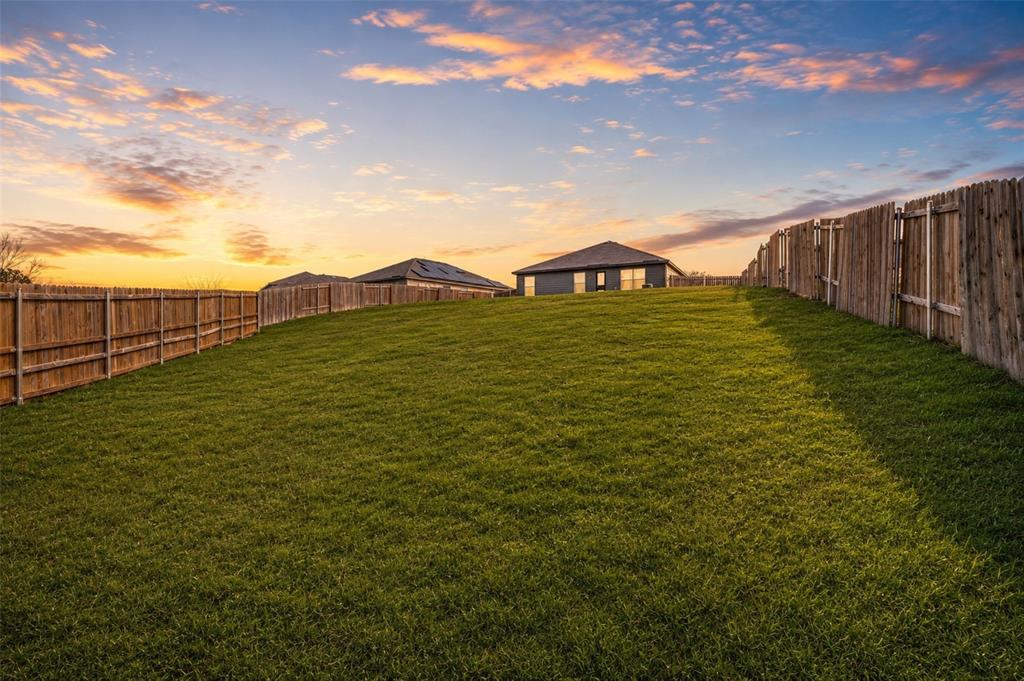 144 Barbwire Way Newark, TX 76071 - Photo 27 of 32 a view of a pathway with a garden