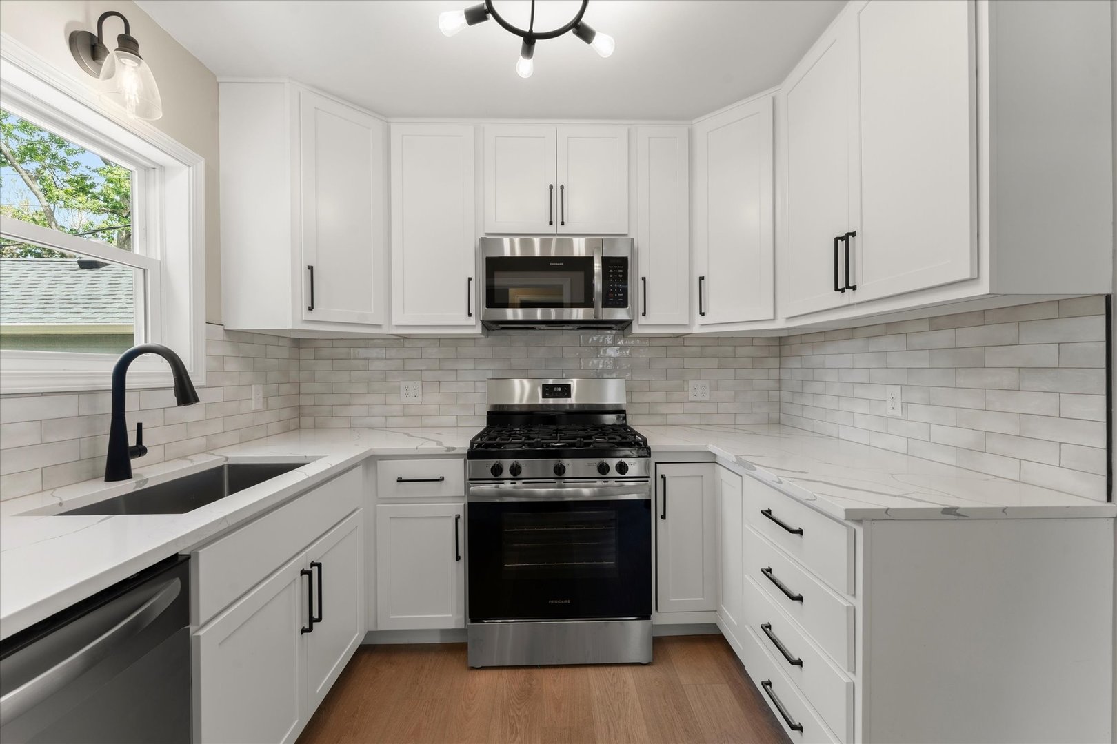 305 South Fair Street Champaign, IL 61821 - Photo 18 of 41 a kitchen with white cabinets and appliances