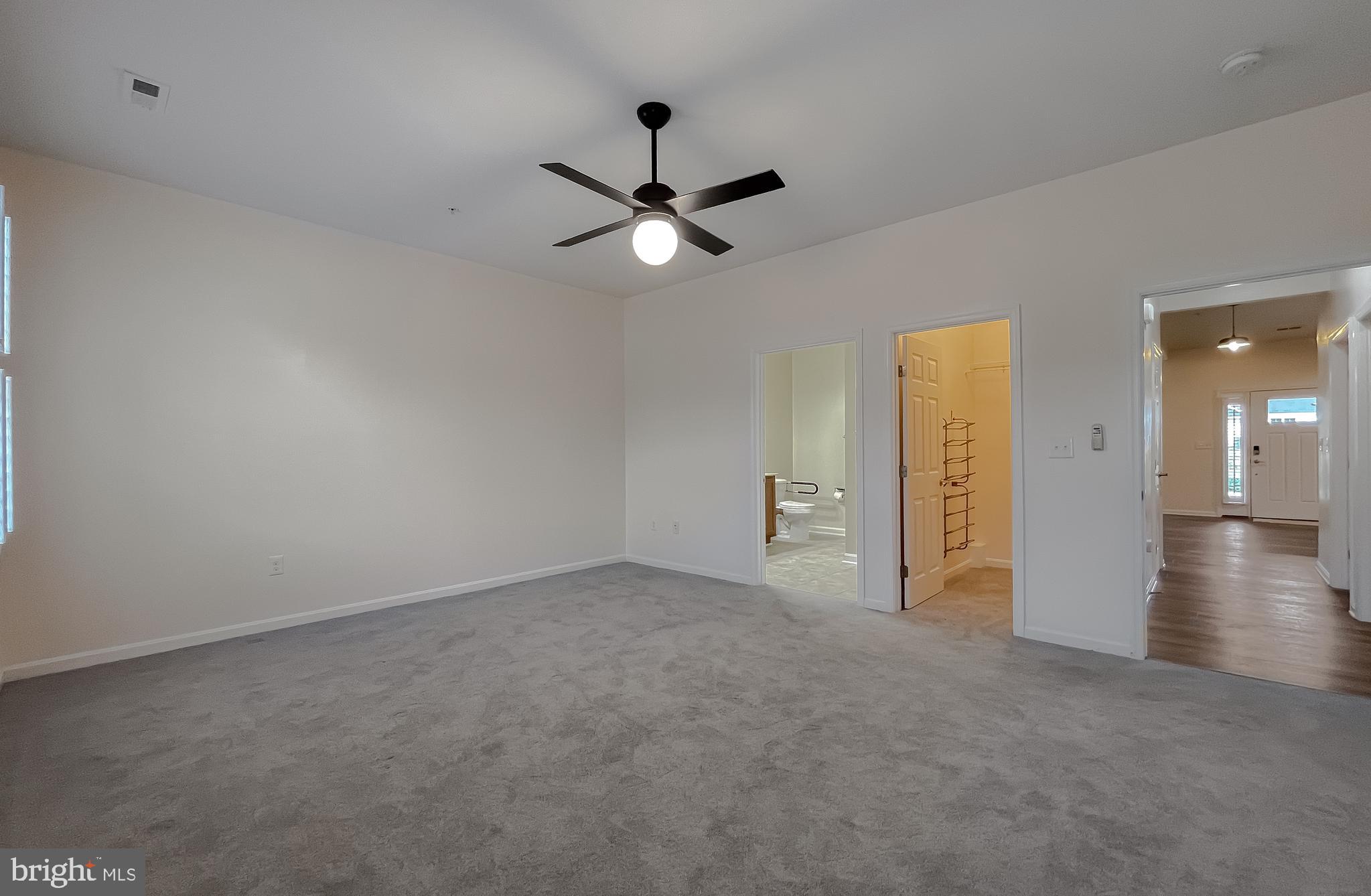 44140 Outrigger Way California, MD 20619 - Photo 25 of 36 Primary Bedroom; Ceiling fan and carpet