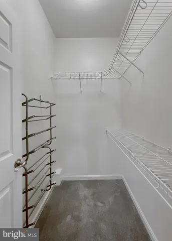 a view of a kitchen with a sink and chandelier