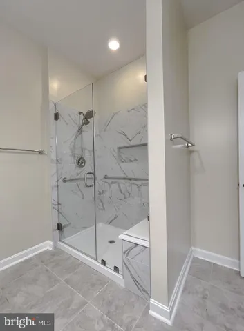 a bathroom with a shower and bathtub