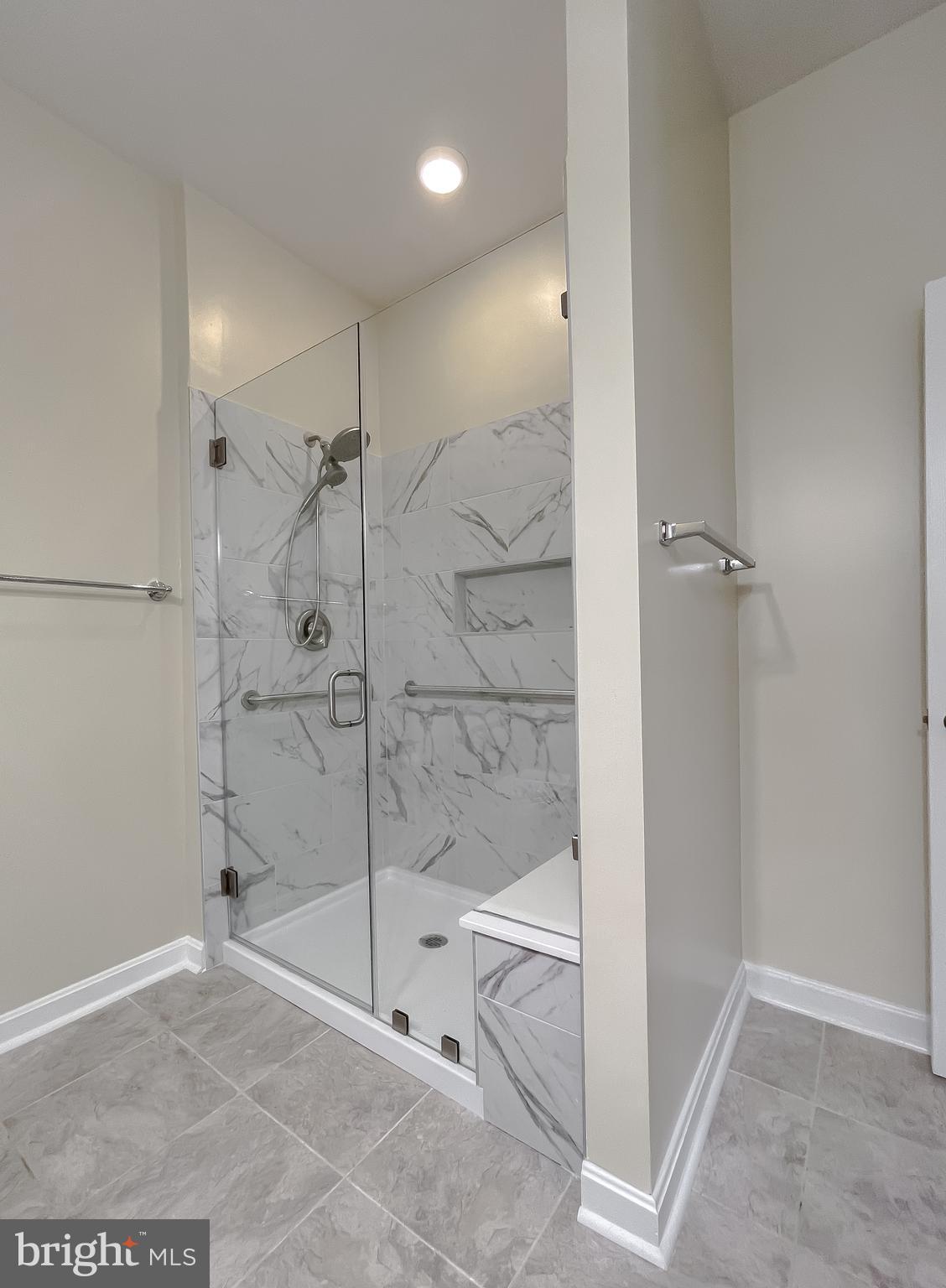 44140 Outrigger Way California, MD 20619 - Photo 30 of 36 Luxury Tiled shower with seating bench