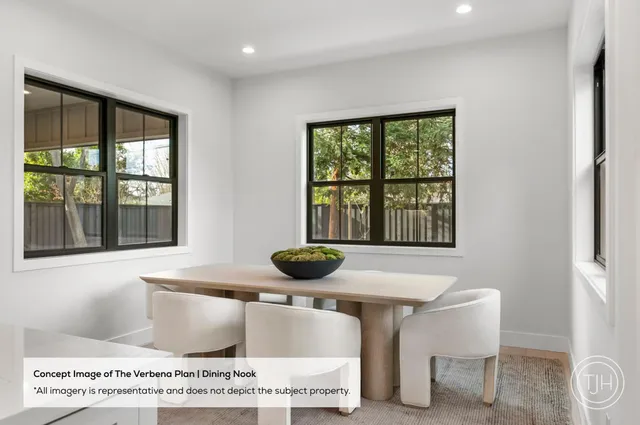 a living room with a table and a window