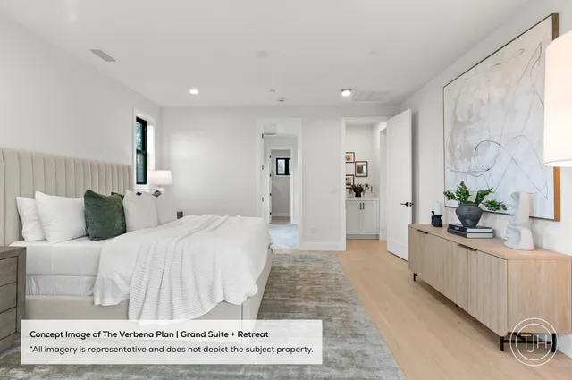 a spacious bedroom with a large bed and a potted plant