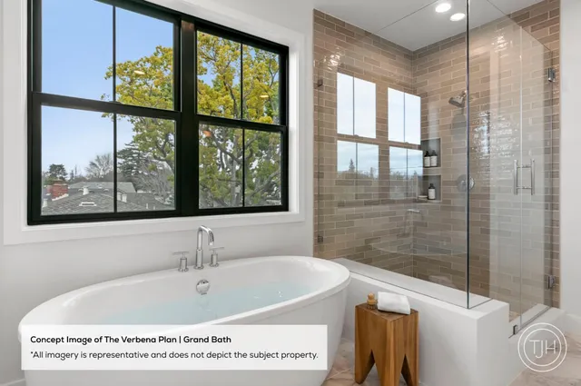 a bath tub sitting next to a window