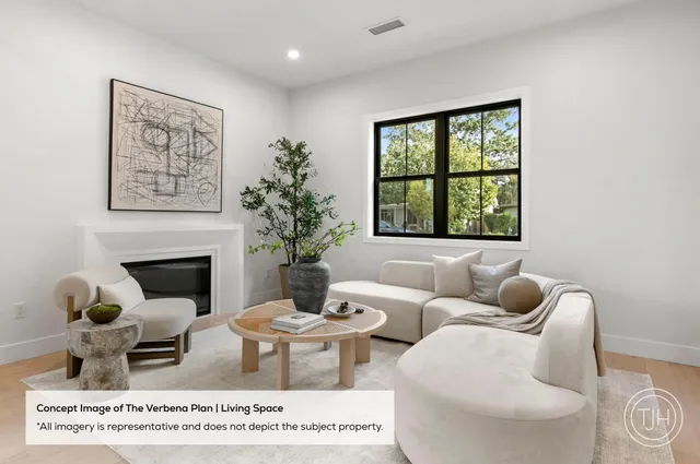a living room with furniture a window and a fireplace