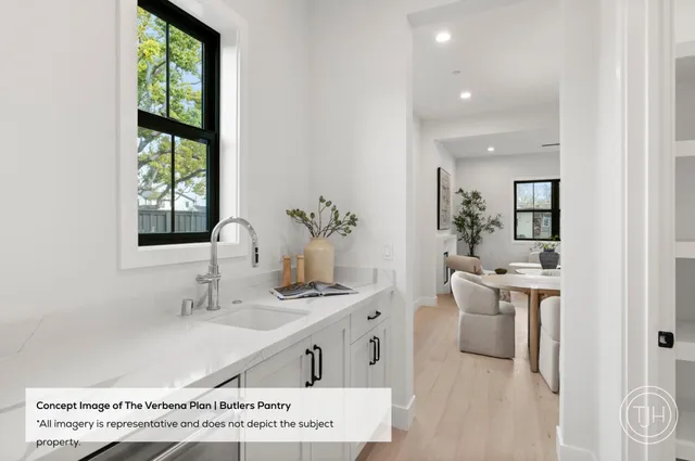 a spacious bathroom with a double vanity sink a mirror and a bathtub