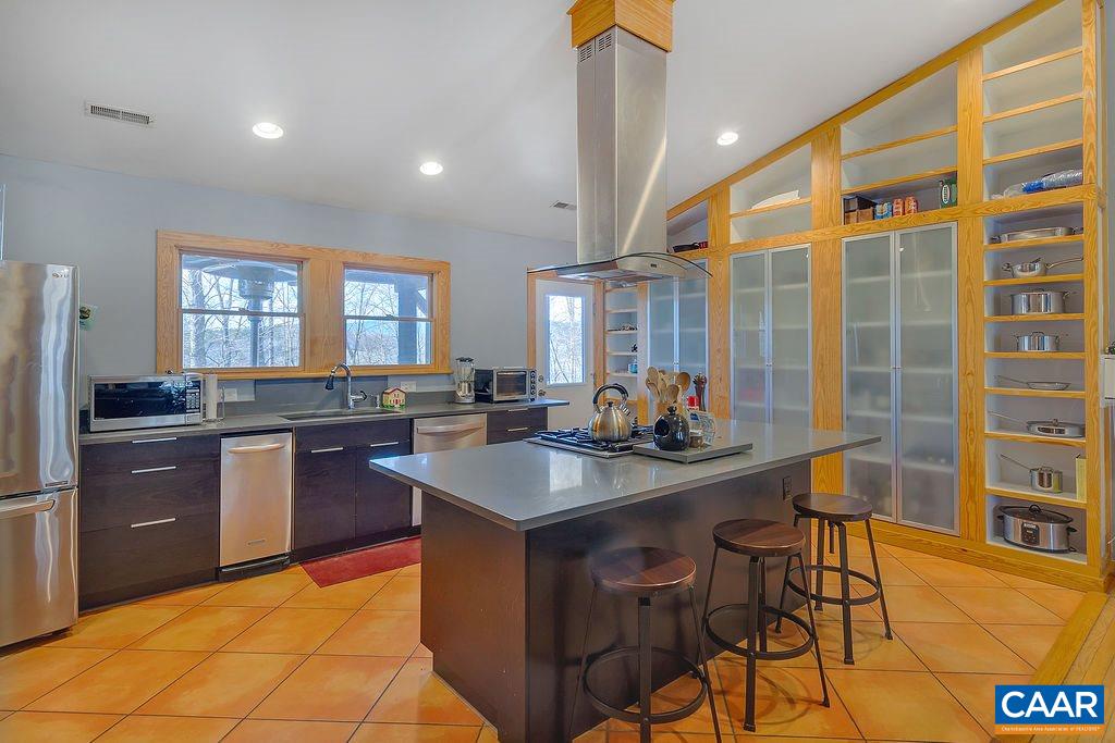 750 Broad Axe Road Charlottesville, VA 22903 - Photo 8 of 42 a kitchen with a sink stove and cabinets