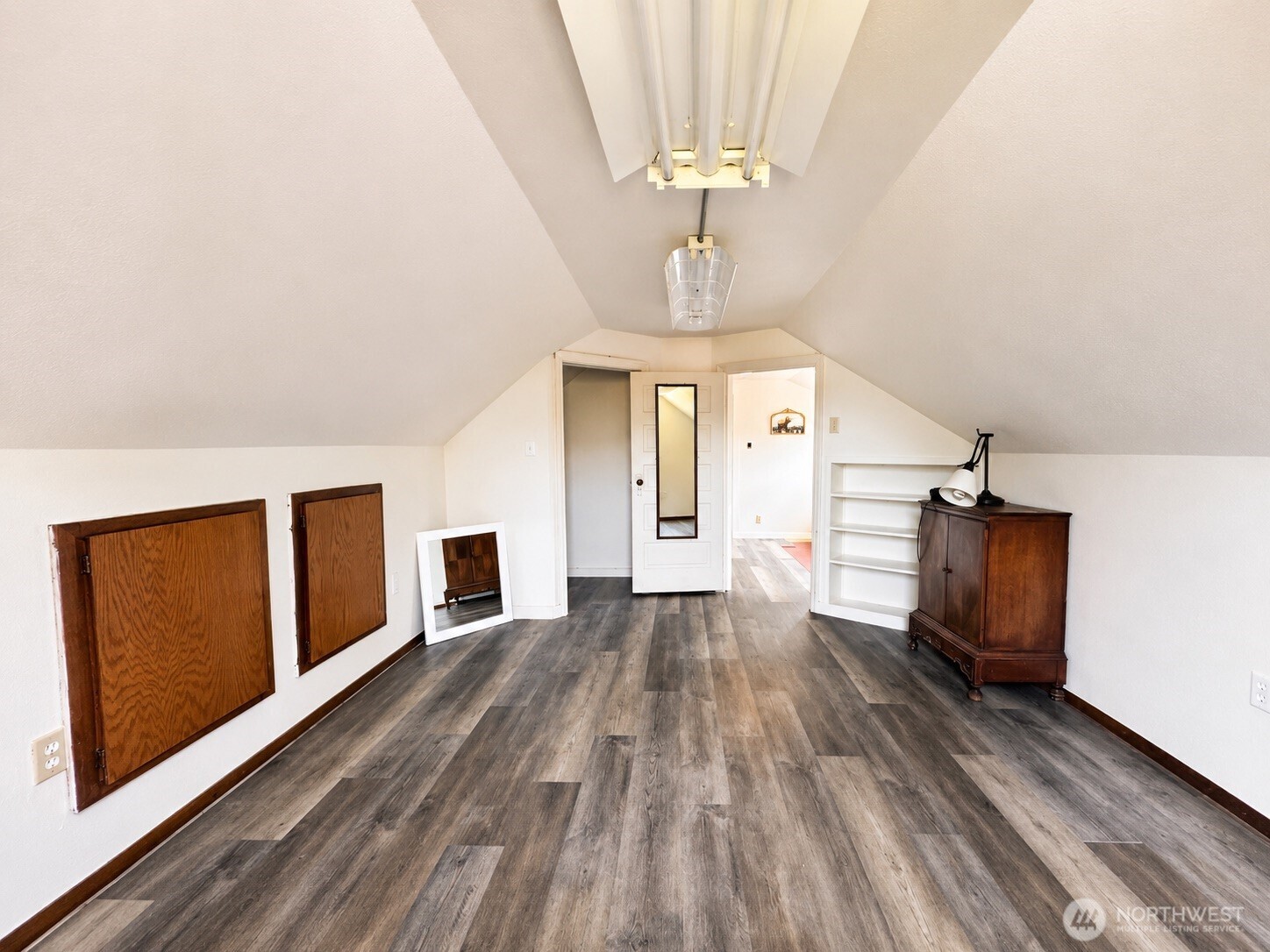 2154 Cranberry Road Grayland, WA 98547 - Photo 23 of 38 a view of a livingroom with wooden floor and chandelier
