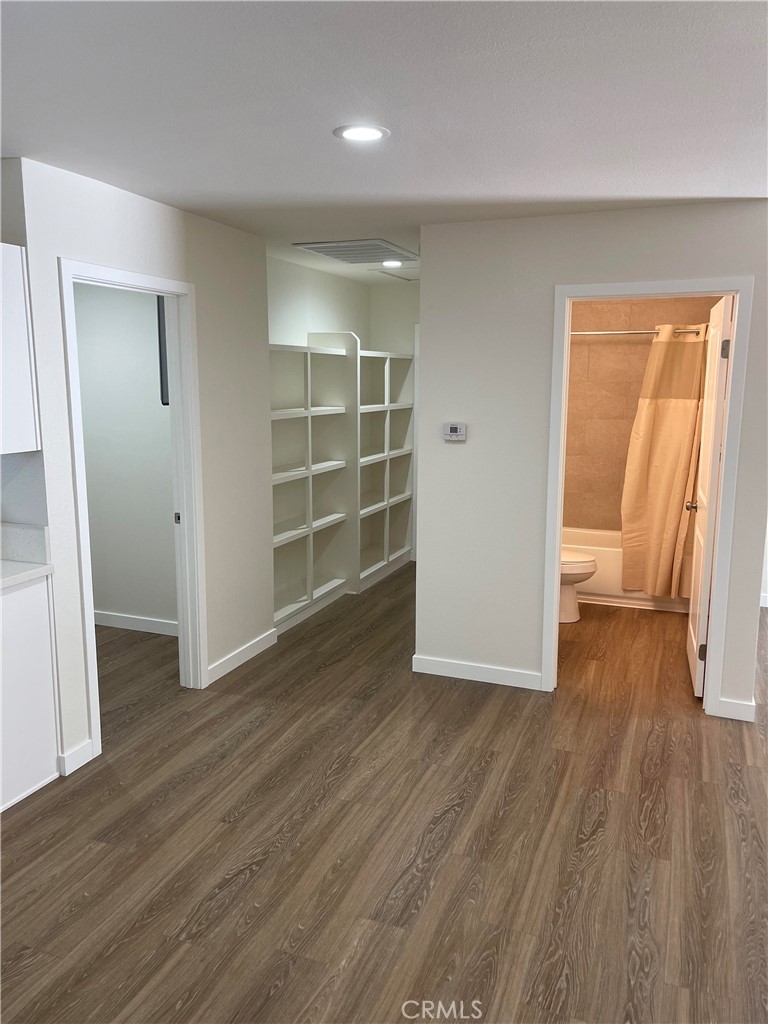 2643 Orange Street Riverside, CA 92501 - Photo 19 of 22 an empty room with wooden floor and closet