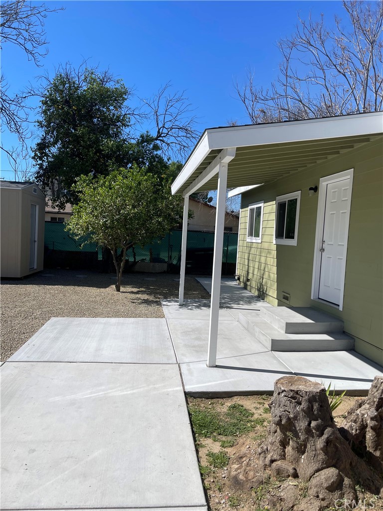 2643 Orange Street Riverside, CA 92501 - Photo 3 of 22 a view of a house with a small yard and potted plants