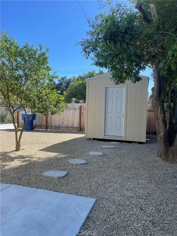 a view of a backyard of the house