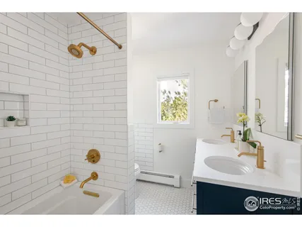 a bathroom with a sink mirror and vanity