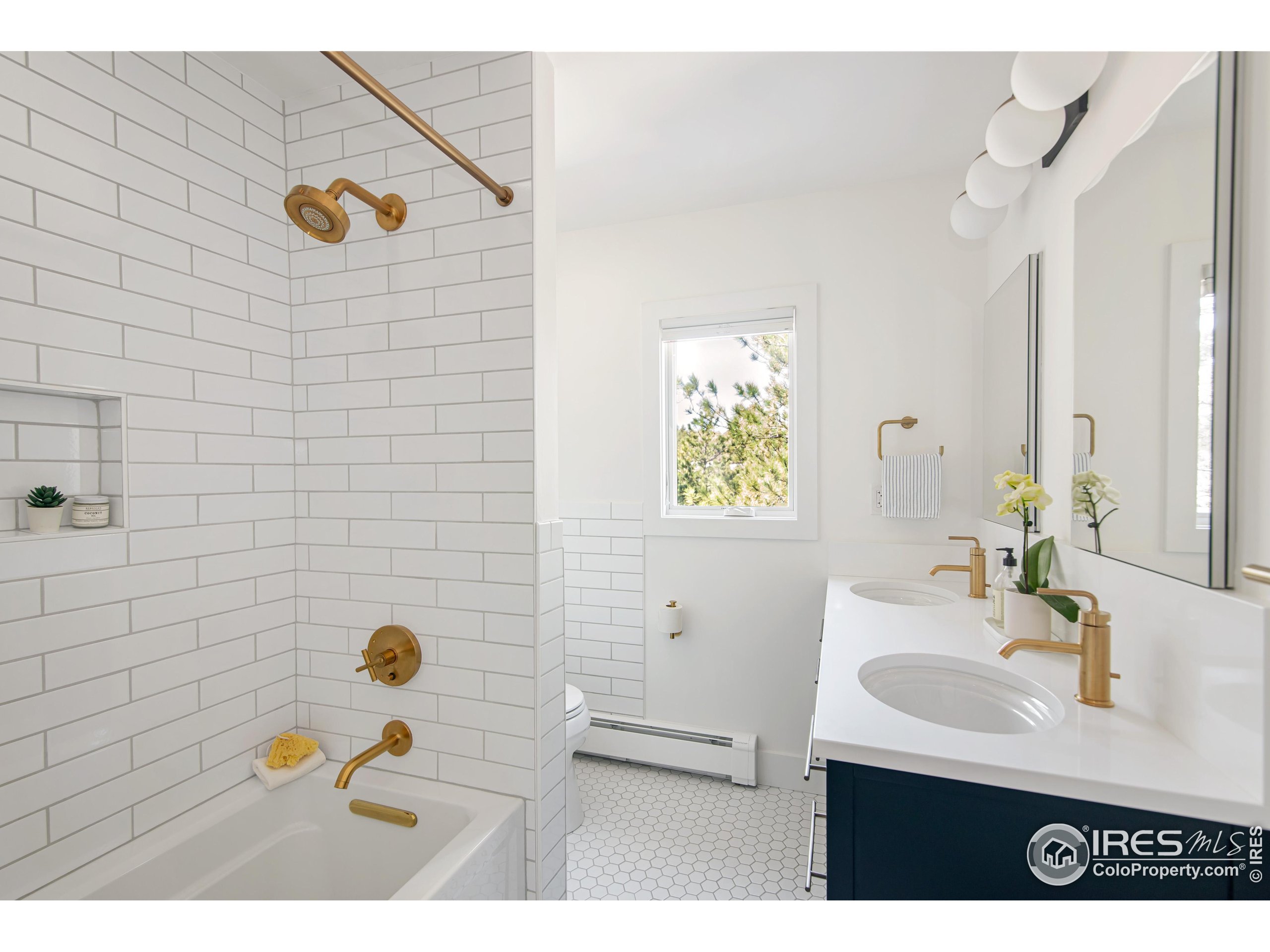 65 Bristlecone Way Boulder, CO 80304 - Photo 13 of 49 a bathroom with a sink mirror and vanity