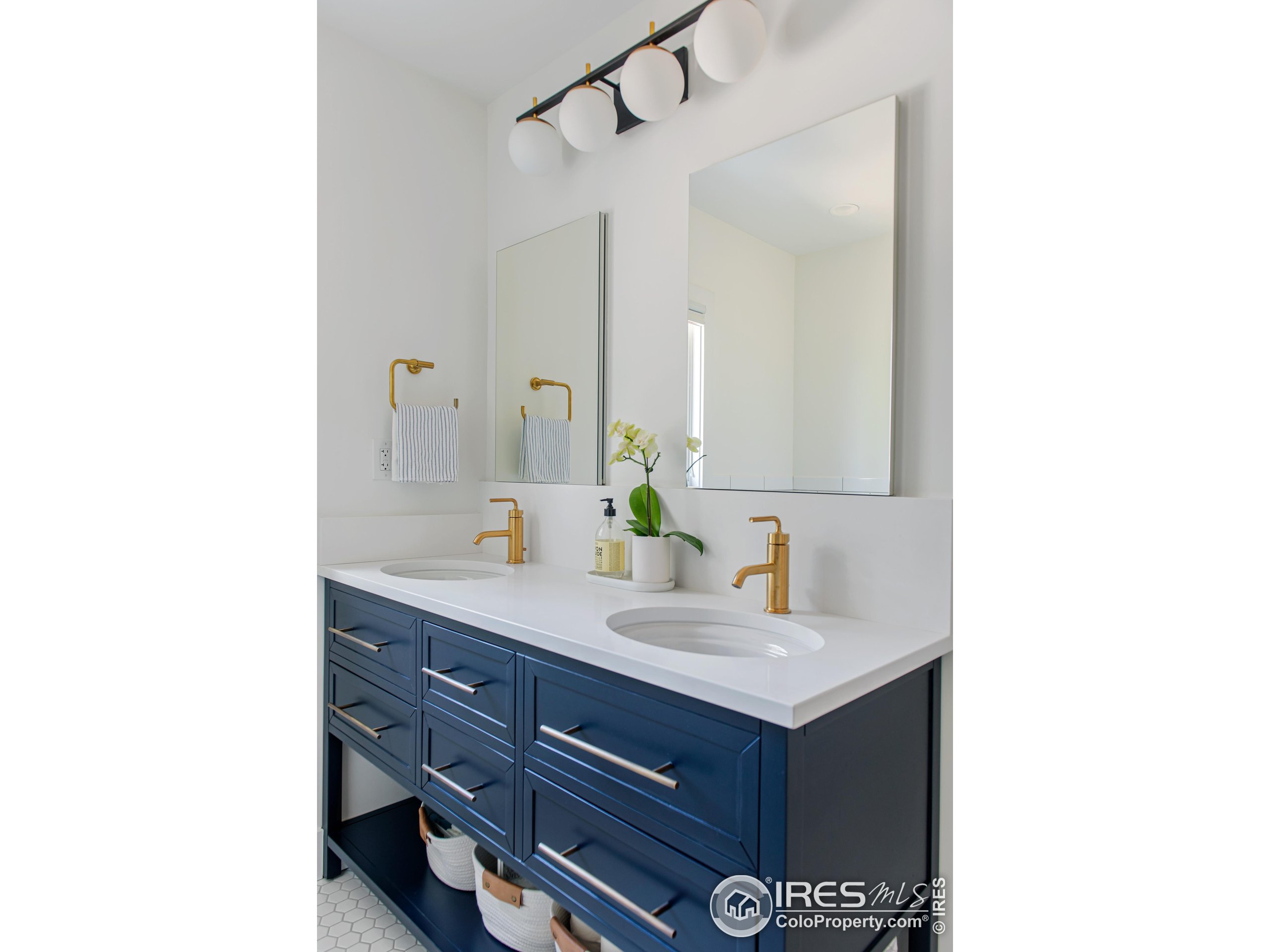 65 Bristlecone Way Boulder, CO 80304 - Photo 14 of 49 a bathroom with a sink and a mirror
