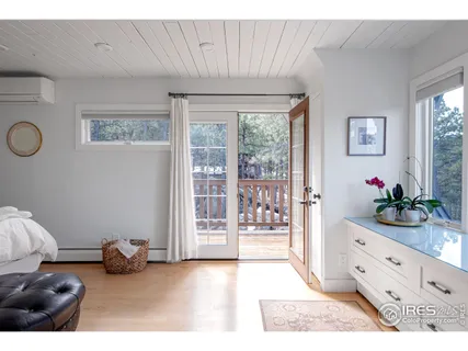 a view of a living room with a large window