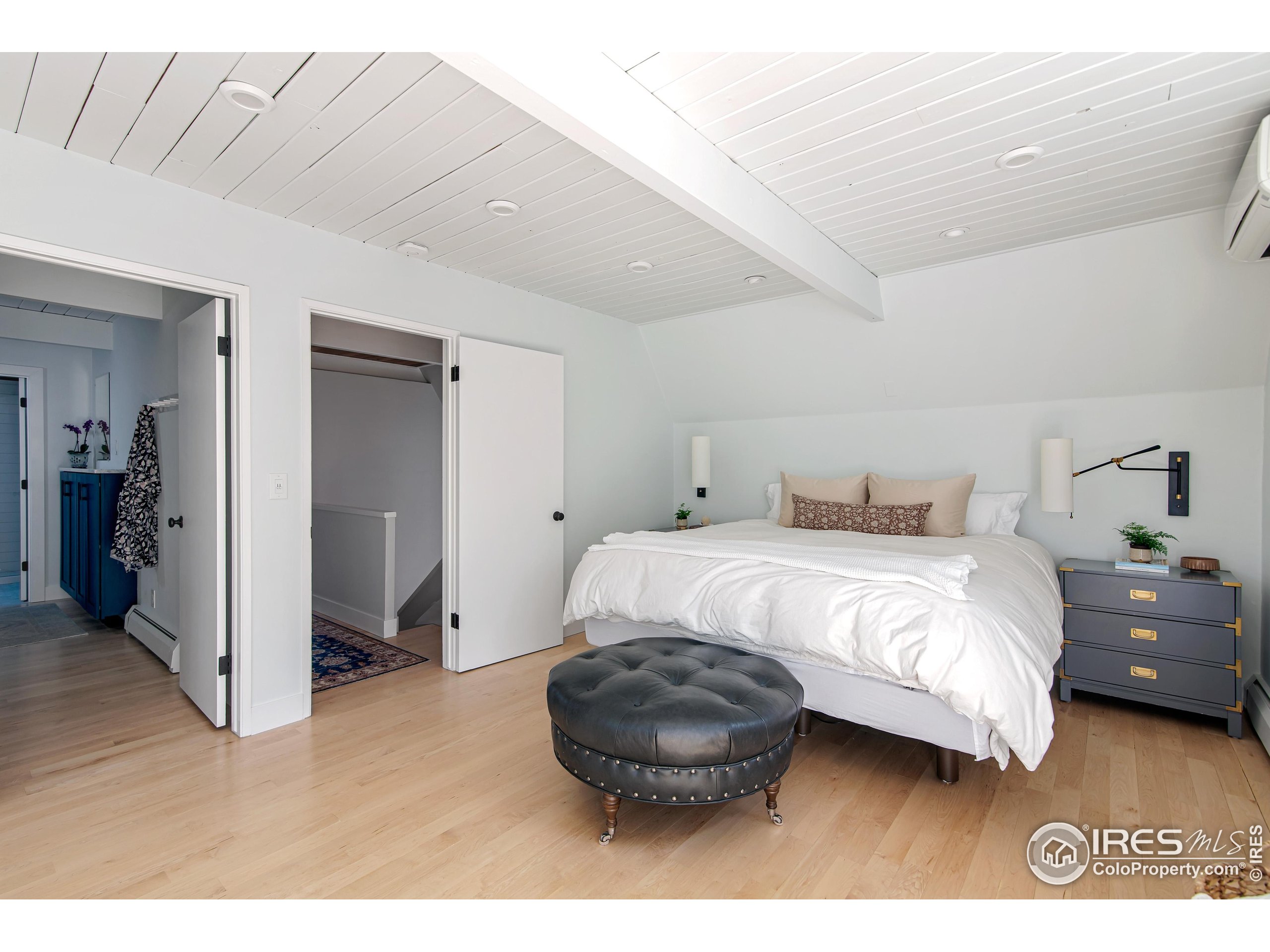 65 Bristlecone Way Boulder, CO 80304 - Photo 21 of 49 a bedroom with a bed and a view of bathroom