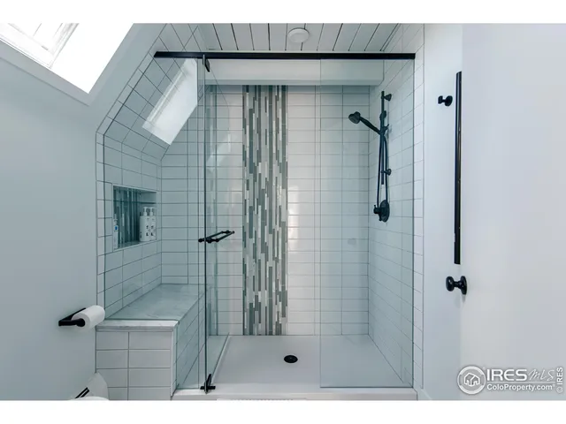 a bathroom with a sink a mirror and a toilet