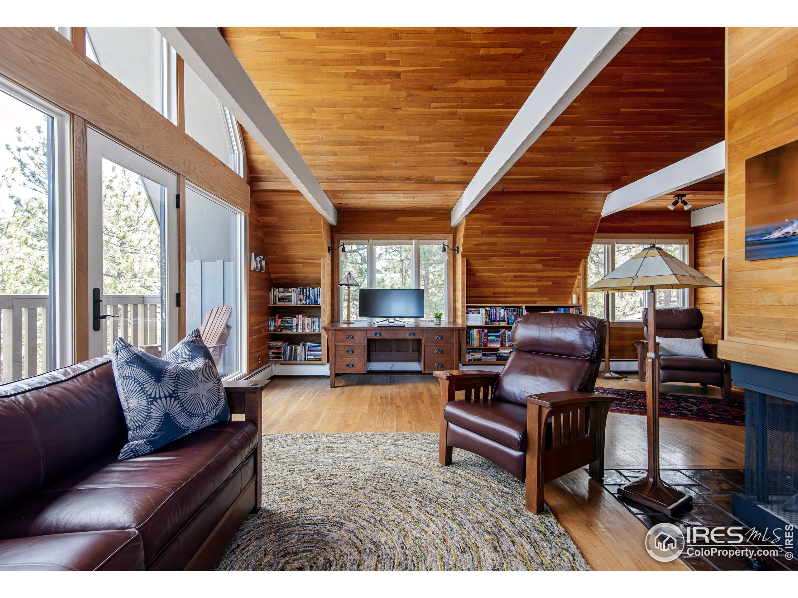 65 Bristlecone Way Boulder, CO 80304 - Photo 27 of 49 a living room with furniture and a wooden floor