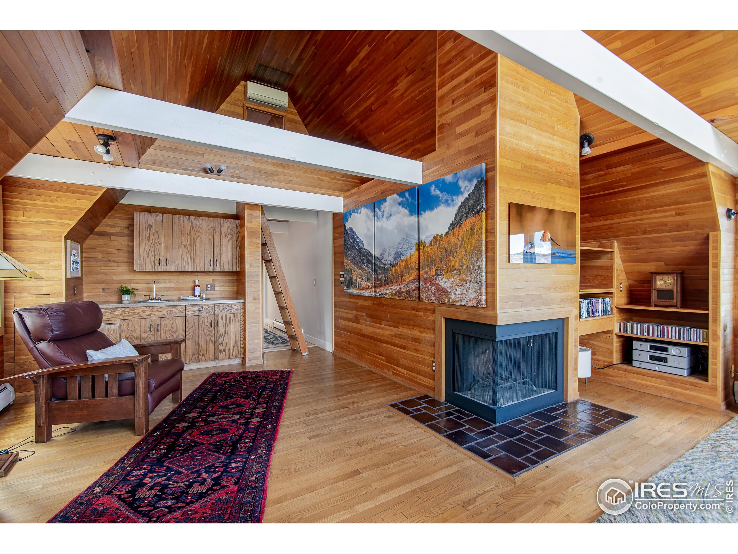 65 Bristlecone Way Boulder, CO 80304 - Photo 28 of 49 a living room with furniture and a fireplace