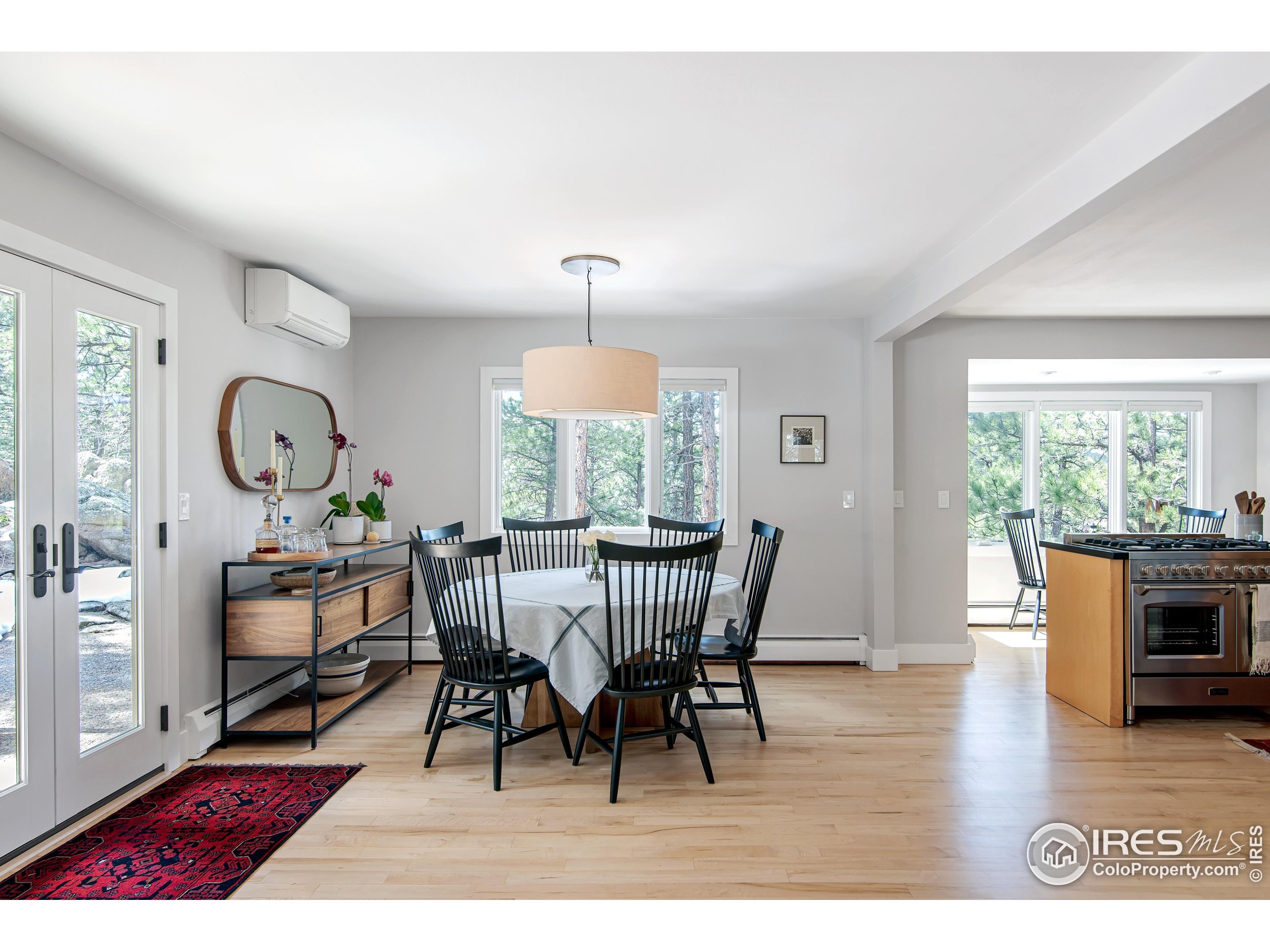 65 Bristlecone Way Boulder, CO 80304 - Photo 32 of 49 a view of a dining room with furniture window and wooden floor