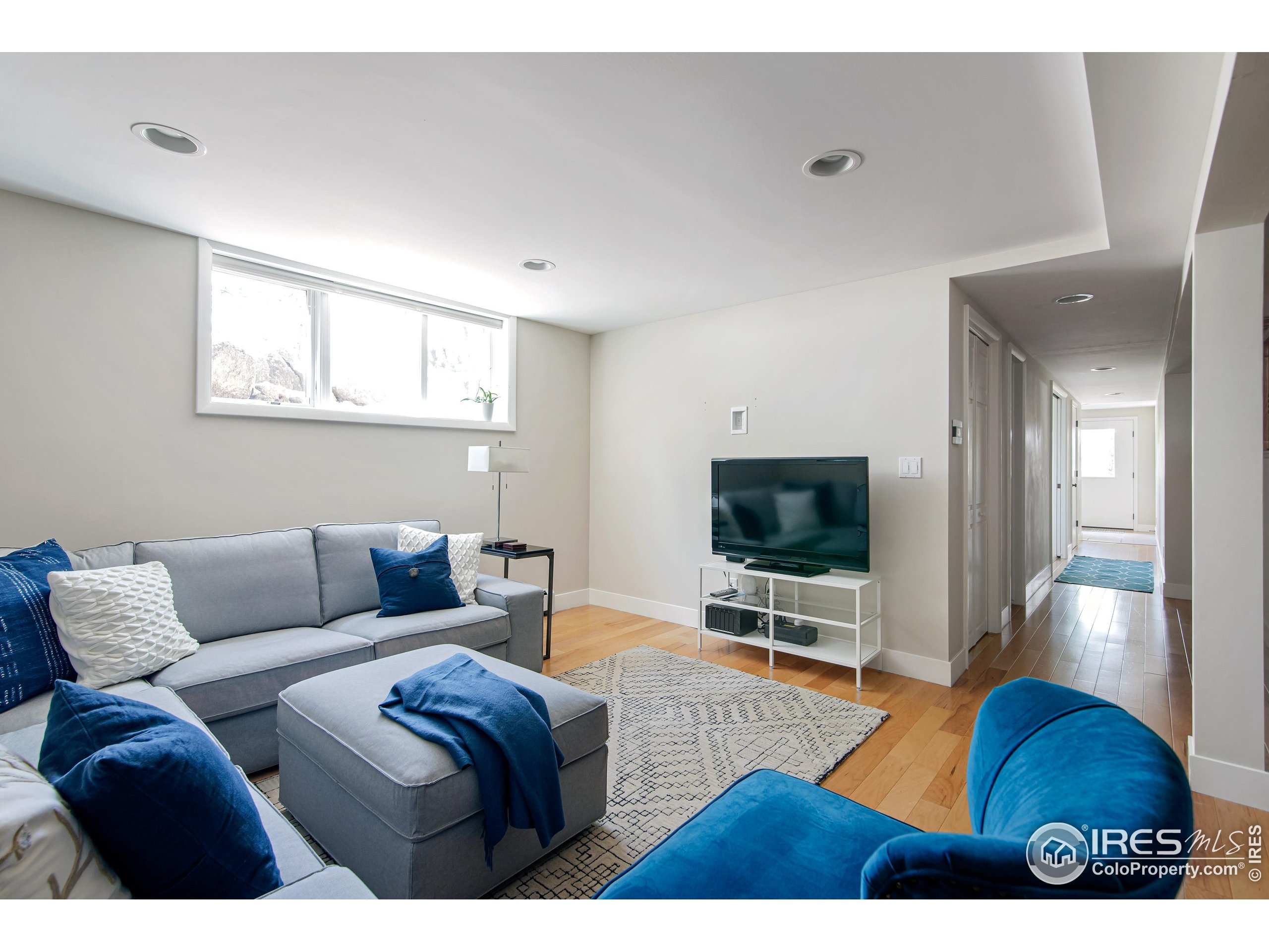 65 Bristlecone Way Boulder, CO 80304 - Photo 36 of 49 a living room with furniture and a flat screen tv