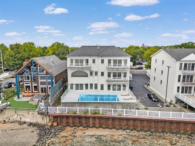 an aerial view of a house with a swimming pool