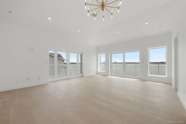 a view of balcony with wooden floor and fence