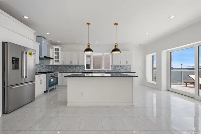 a living room with furniture kitchen and a table