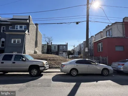 a view of a car parked in front of a house