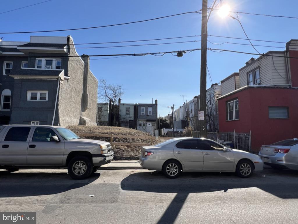 a view of a car parked in front of a house