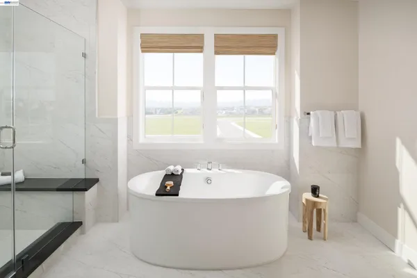 a white bath tub sitting in a bathroom