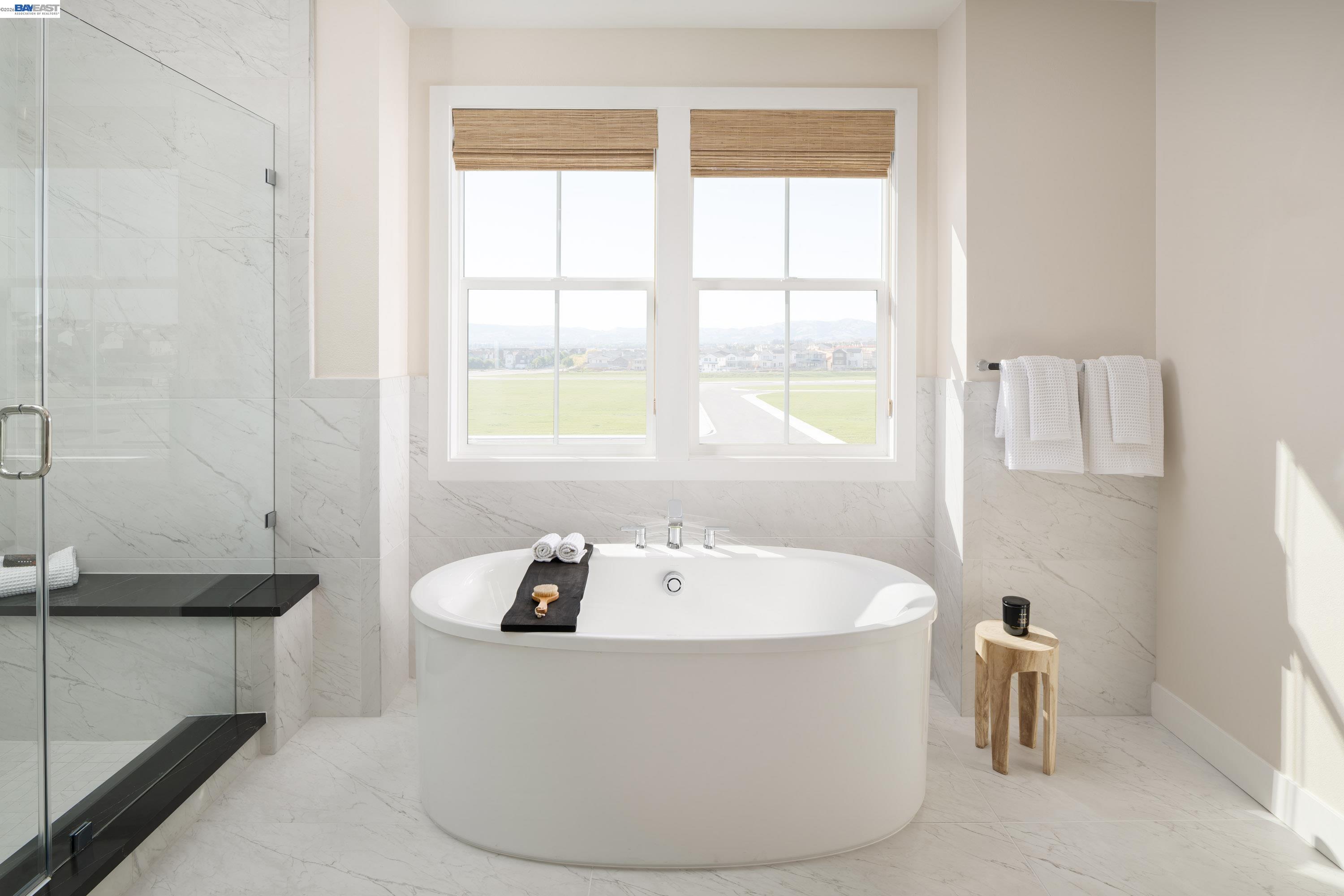 3868 Hereford Road Dublin, CA 94568 - Photo 12 of 22 a white bath tub sitting in a bathroom