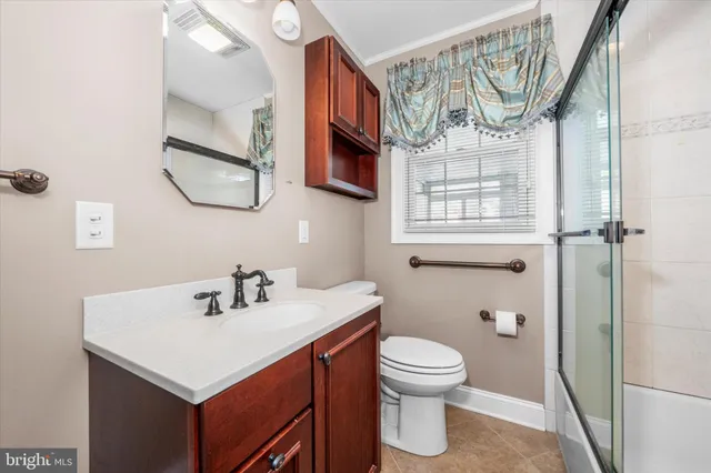 a bathroom with a sink a mirror and a toilet