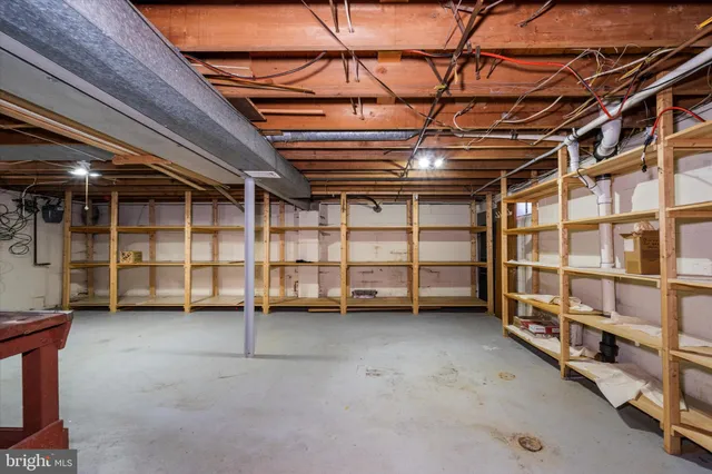 a view of an empty room with storage