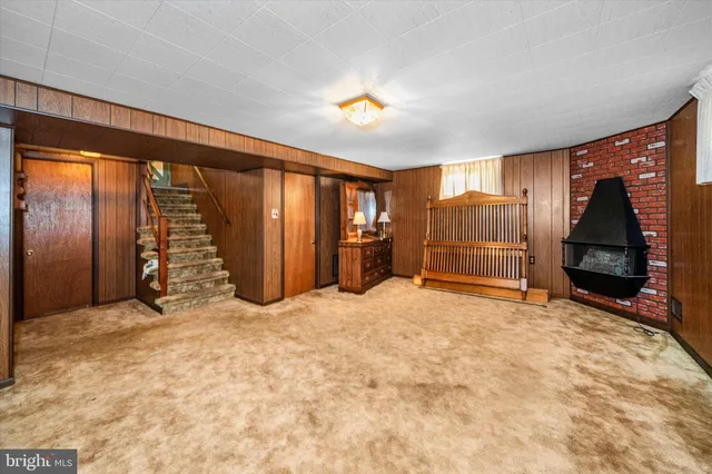 a view of an empty room with closet area