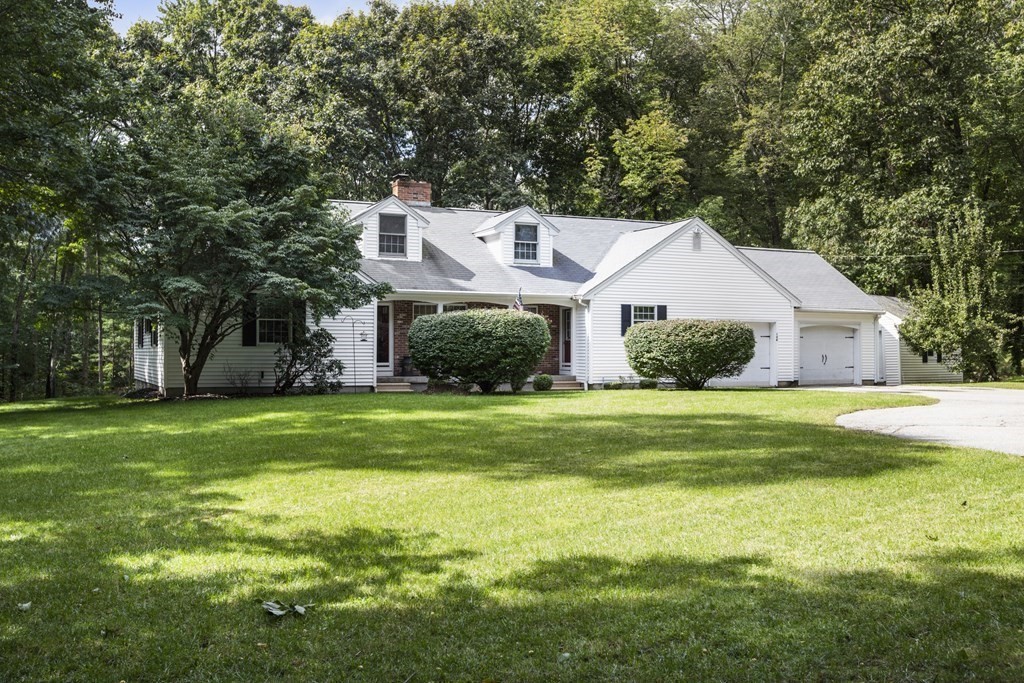 138 Lincoln Road Sutton, MA 01590 - Photo 35 of 35 a front view of a house with a yard and trees