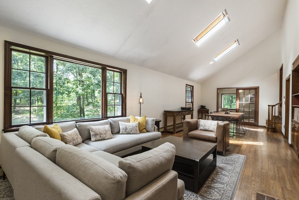 138 Lincoln Road Sutton, MA 01590 - Photo 7 of 35 a living room with furniture and a large window