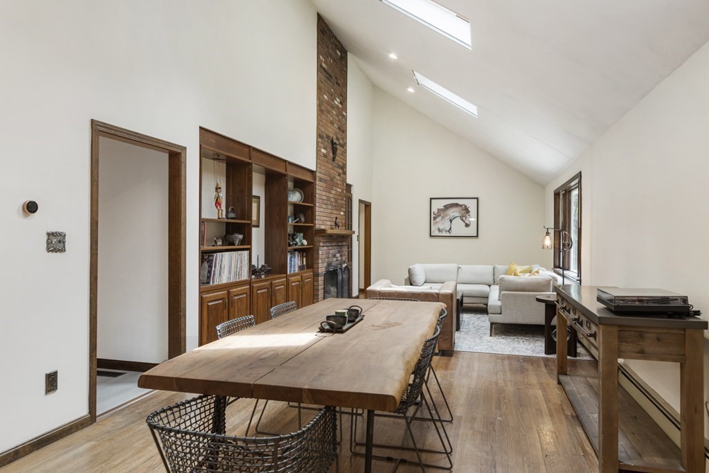 138 Lincoln Road Sutton, MA 01590 - Photo 8 of 35 a view of a dining room with furniture and wooden floor