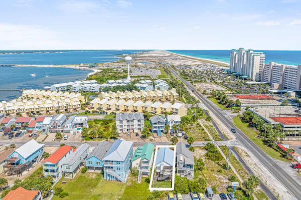 an aerial view of residential building and lake