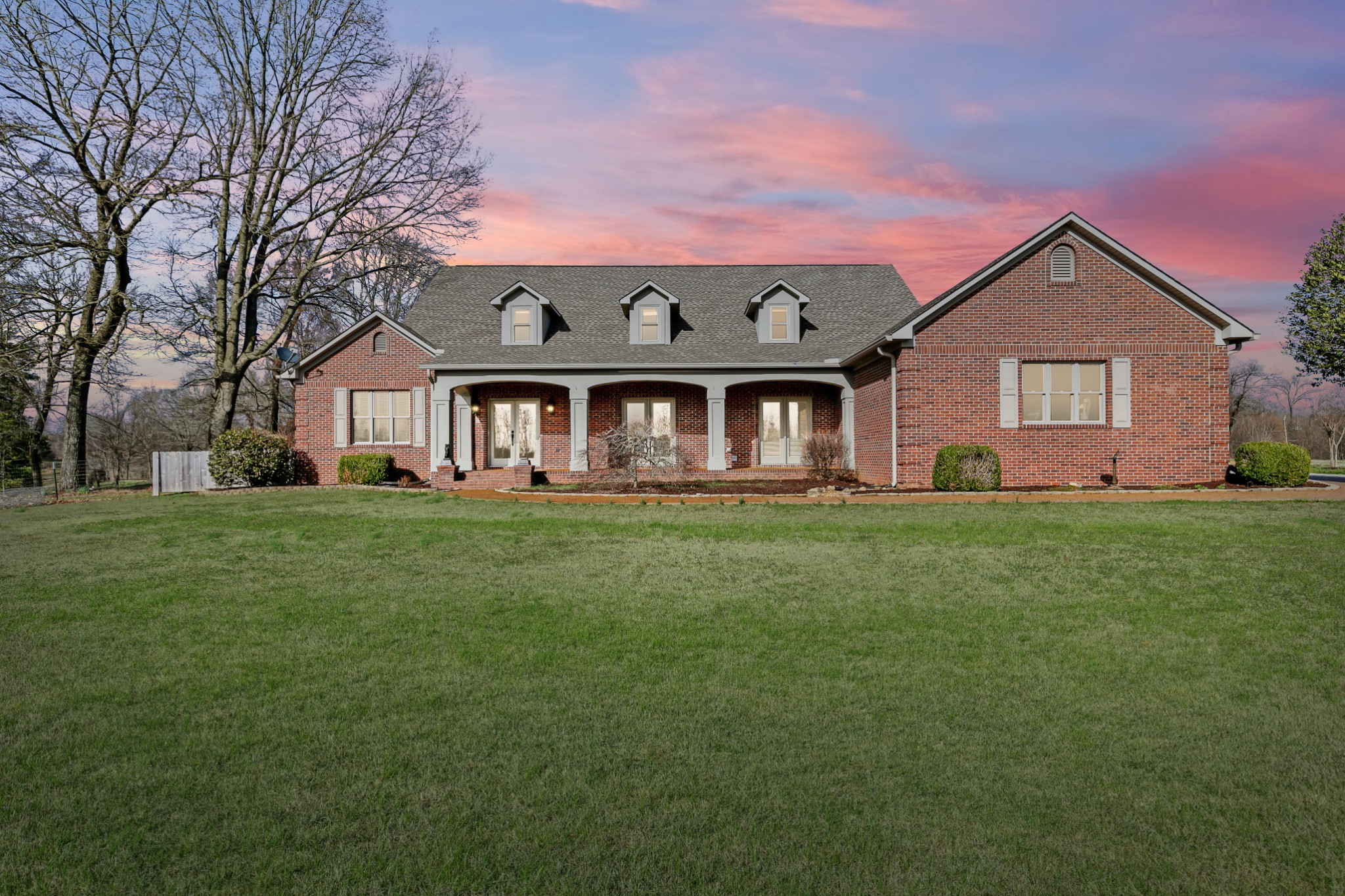 407 McLeary Road Jackson, TN 38305 - Photo 1 of 42 a front view of a house with a yard