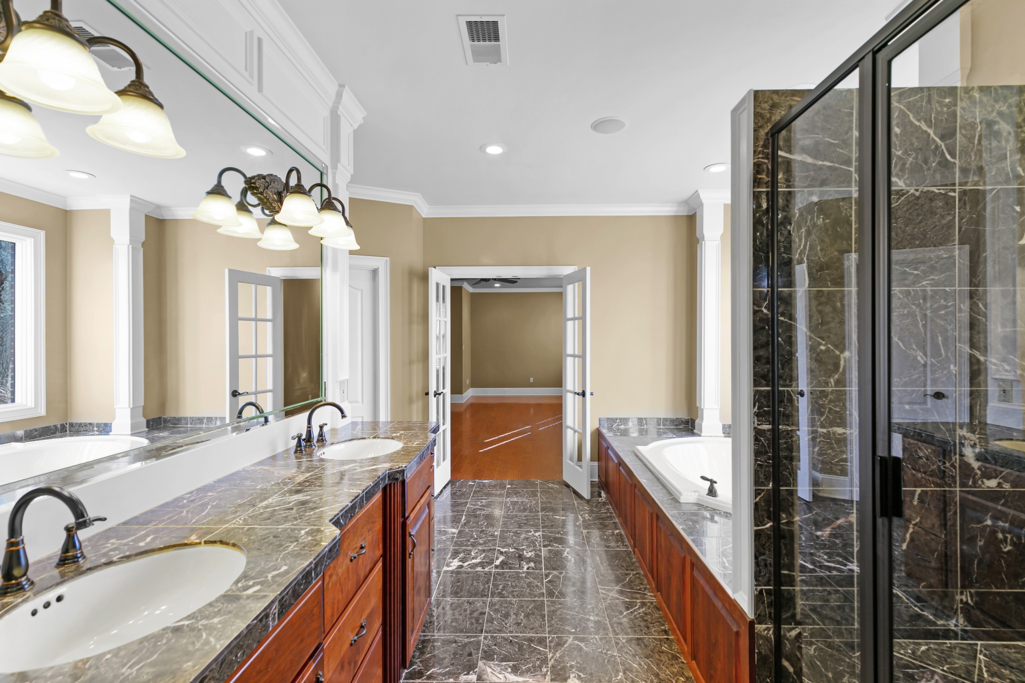 407 McLeary Road Jackson, TN 38305 - Photo 17 of 42 a bathroom with a granite countertop sink a mirror and a shower