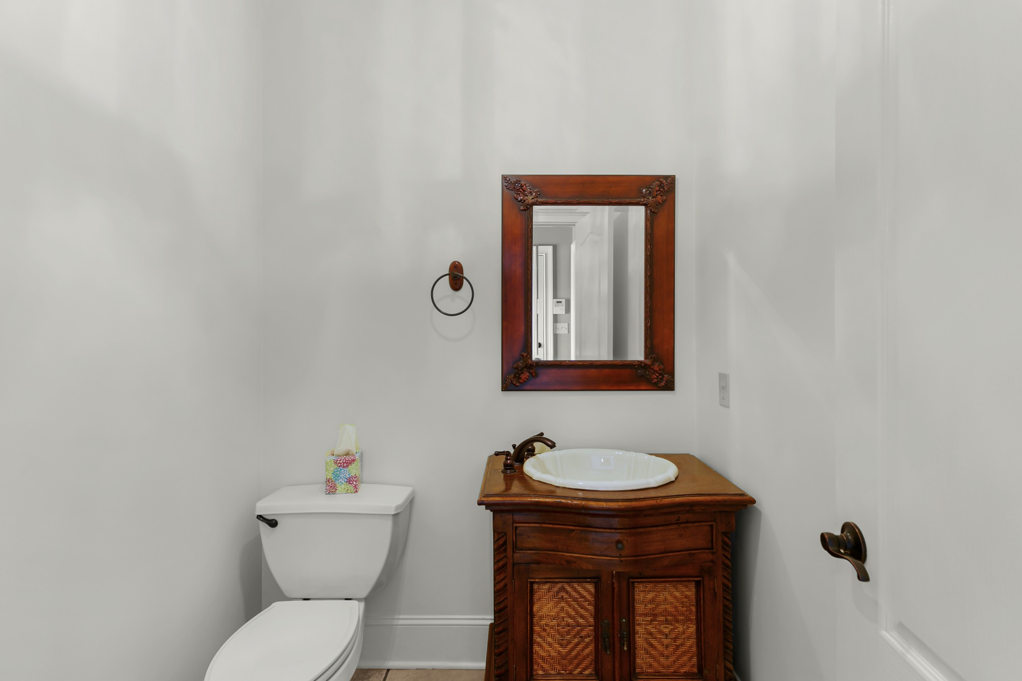 407 McLeary Road Jackson, TN 38305 - Photo 20 of 42 a bathroom with a toilet a sink and mirror