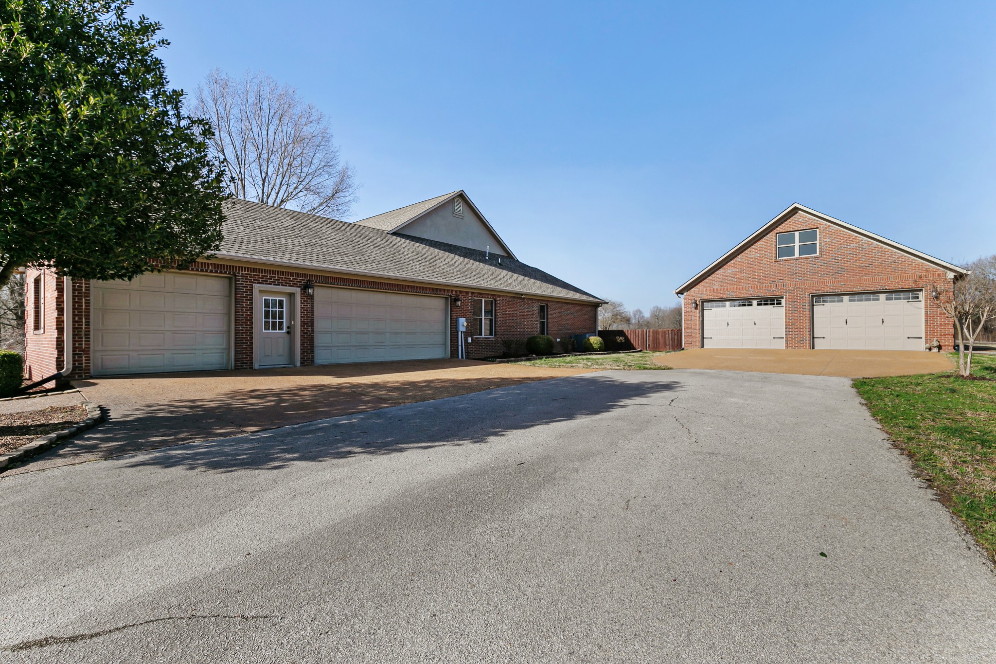 407 McLeary Road Jackson, TN 38305 - Photo 24 of 42 a front view of a house with a yard and garage