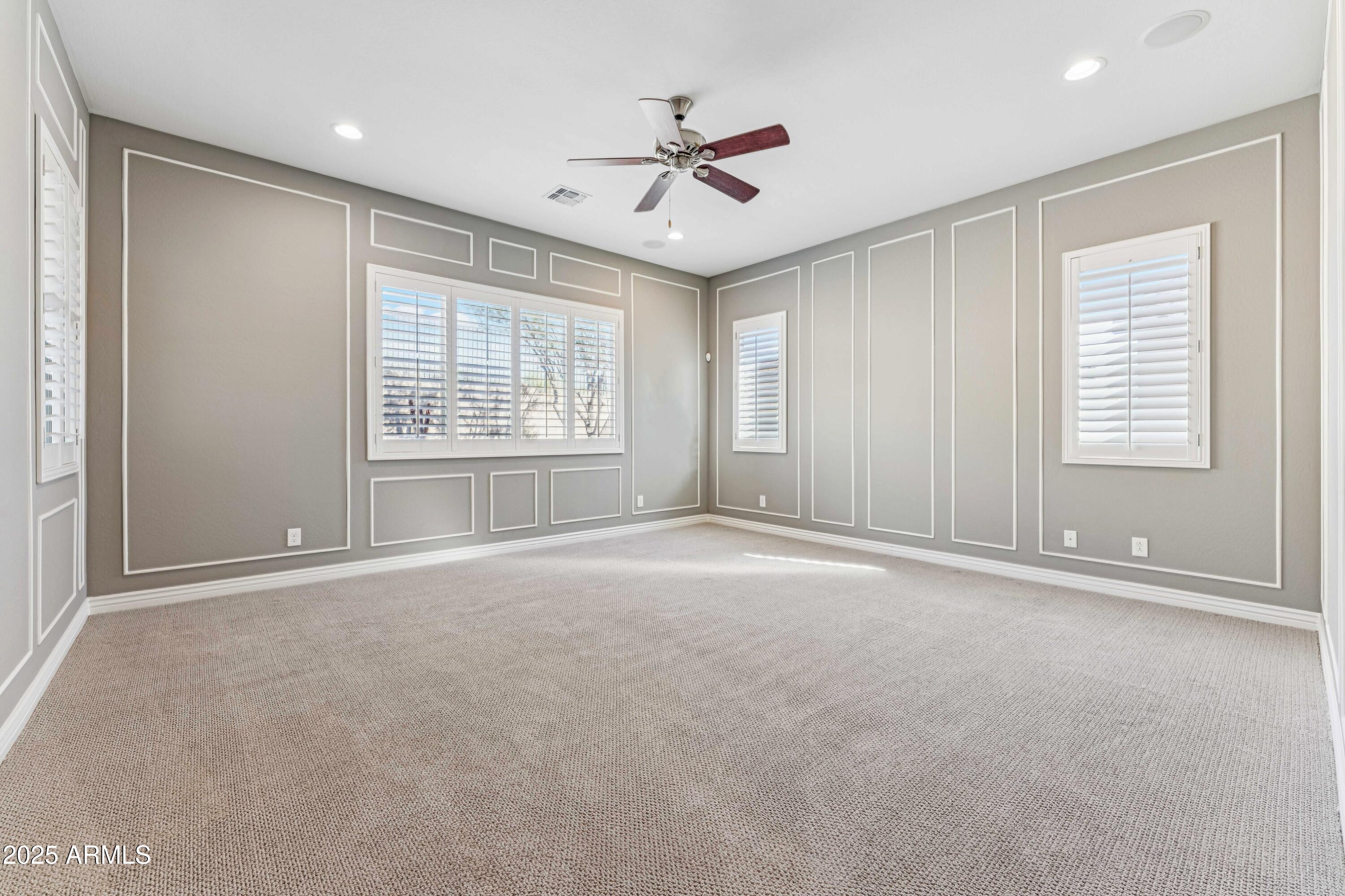9916 West Redbird Road Peoria, AZ 85383 - Photo 18 of 96 a view of an empty room with a window