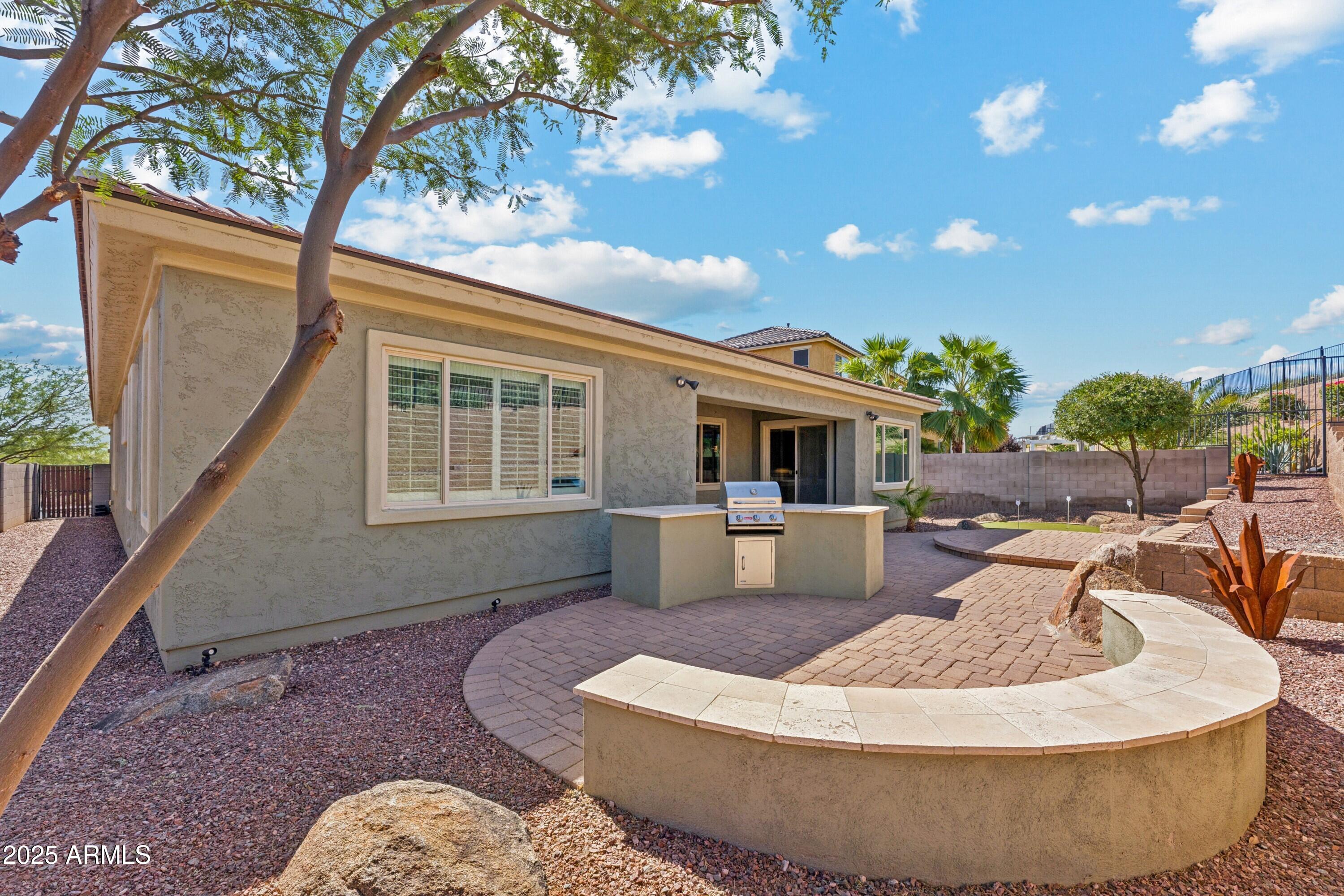 9916 West Redbird Road Peoria, AZ 85383 - Photo 39 of 96 a living room with furniture and a large window