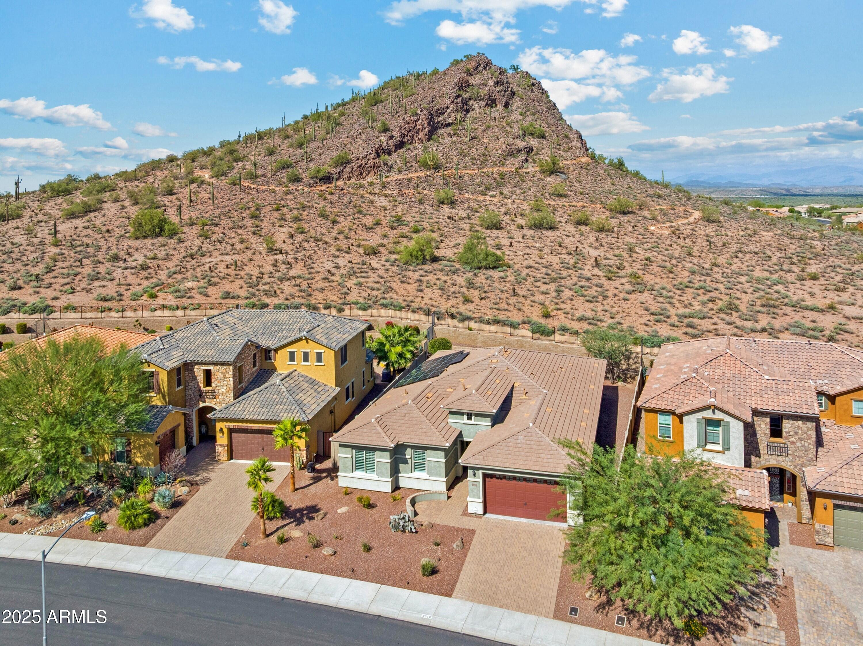 9916 West Redbird Road Peoria, AZ 85383 - Photo 41 of 96 an aerial view of residential houses with outdoor space