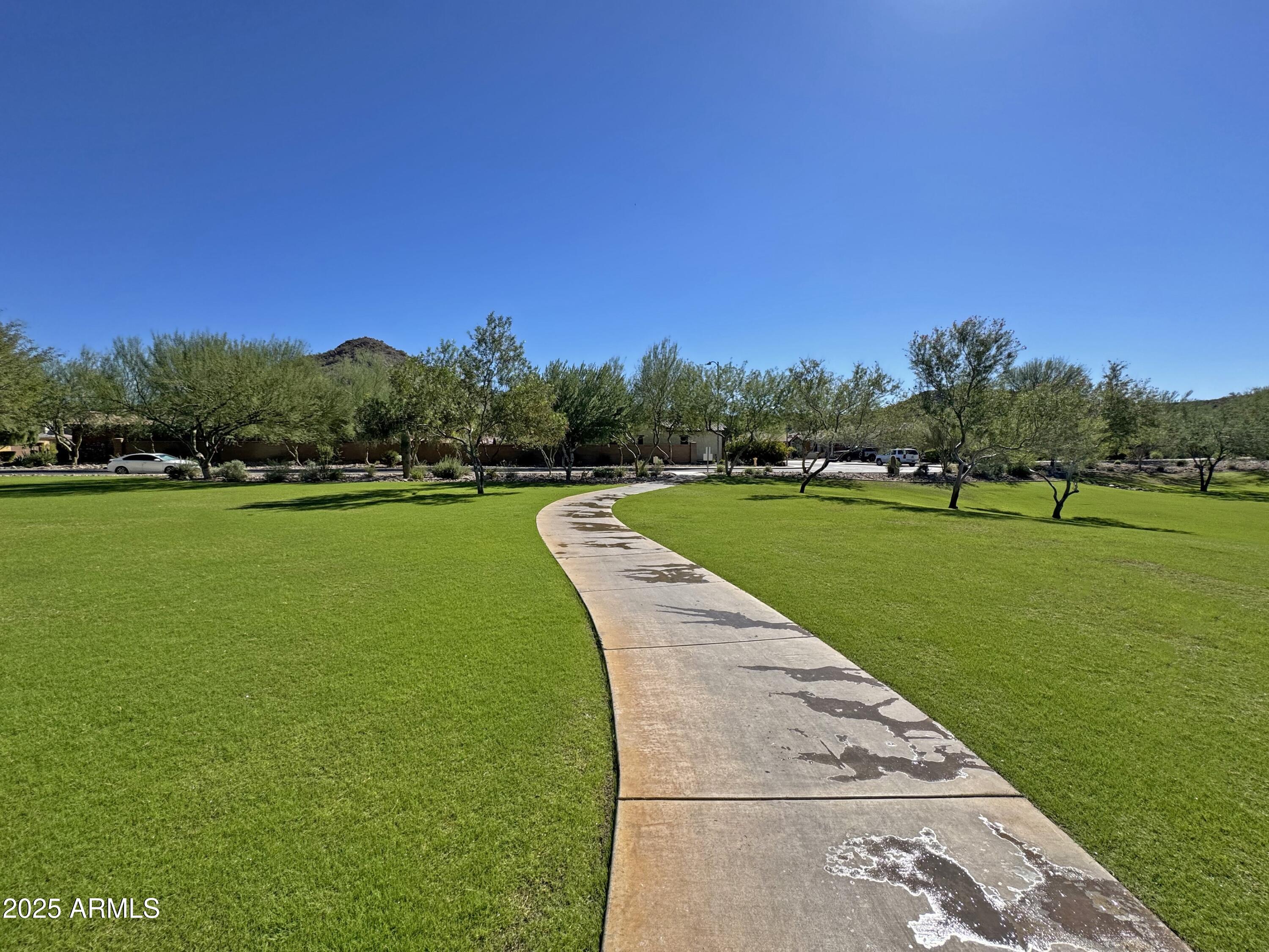 9916 West Redbird Road Peoria, AZ 85383 - Photo 47 of 96 a view of a lake with a big yard